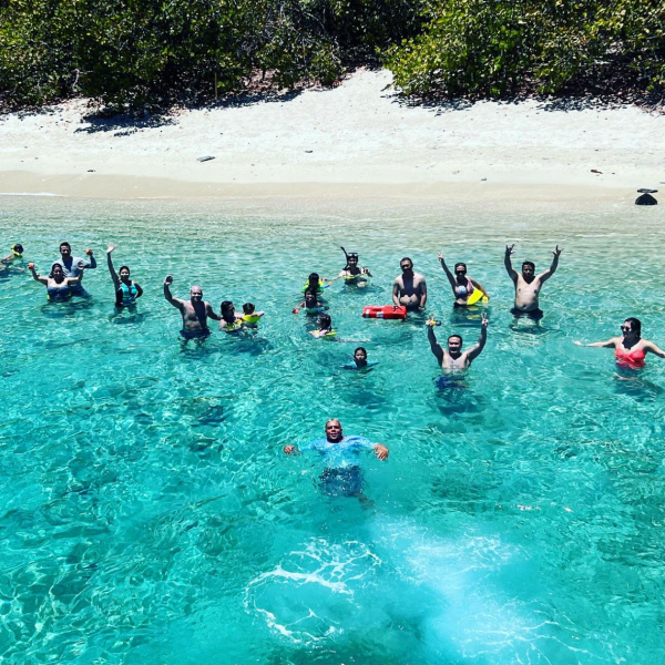 a group of people swimming in the water