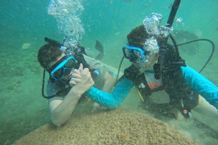 a man swimming in a pool of water