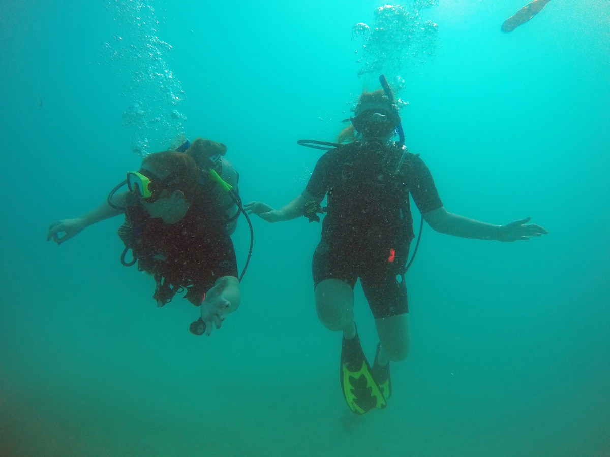 Two scuba divers under the caribbean sea
