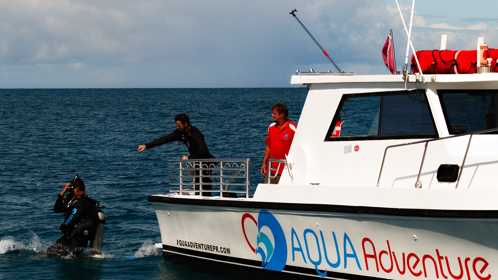 Boat Diver jumping into water from boat